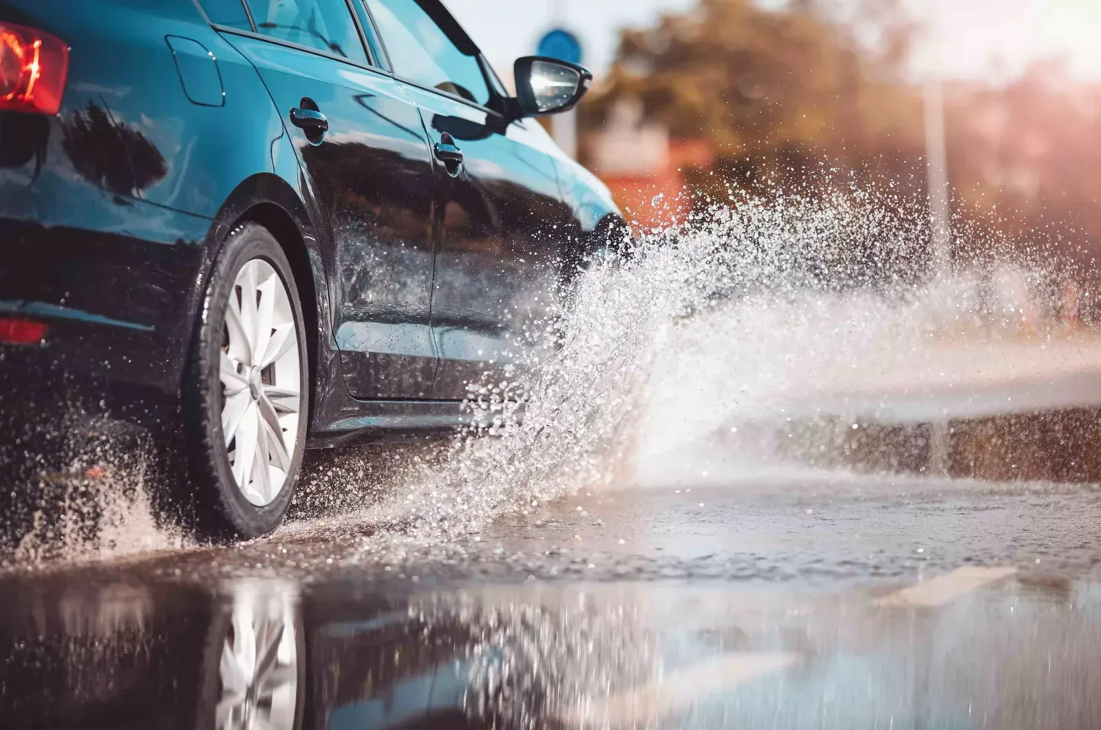 A car splashing through standing water