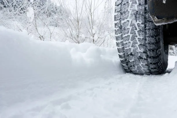 A car tyre in deep snow
